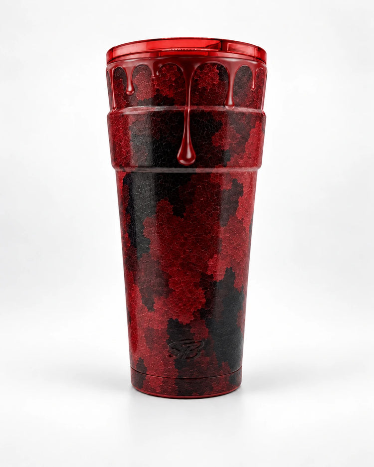 Camo Drip — Red cup with matching translucent lid on a light studio background